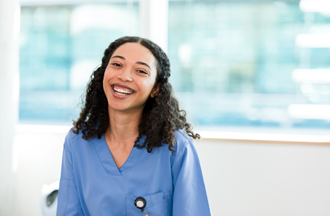 medical assisting student smiling in scrub attire
